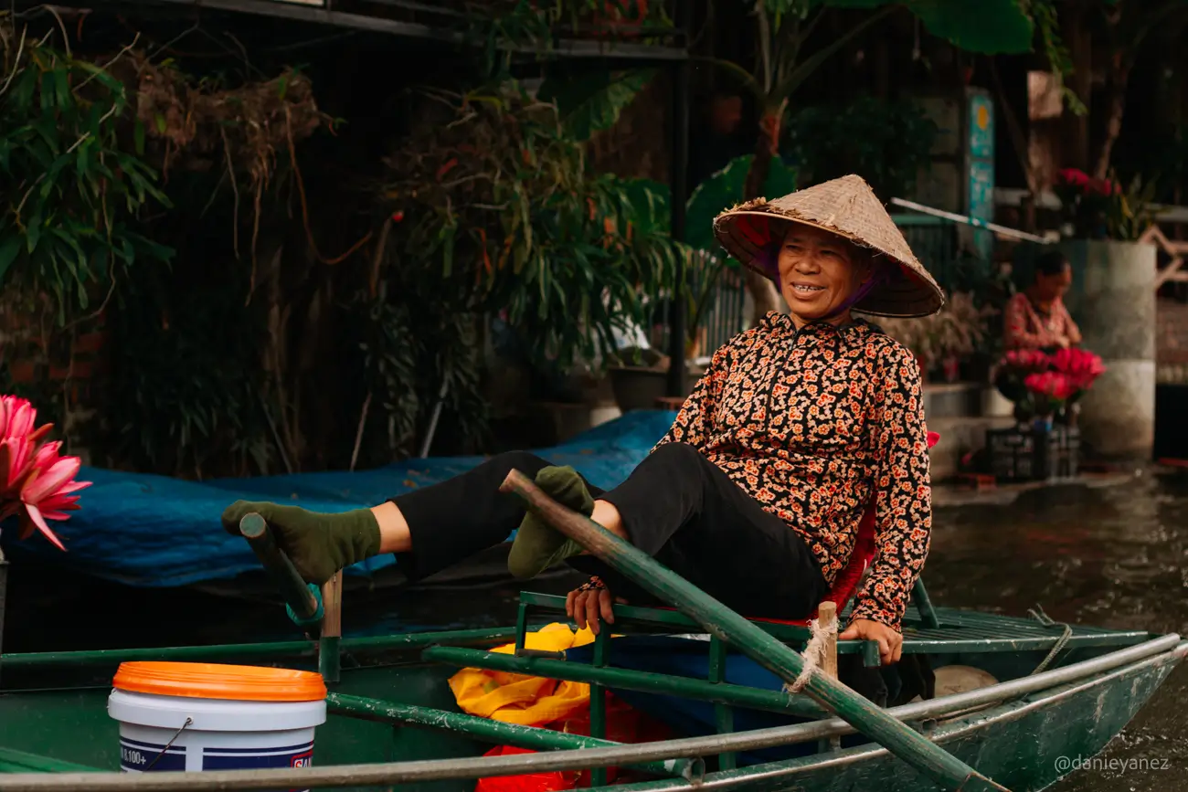 Lady rowing with her feet in Vietnam, Tam Coc, Ninh Binh